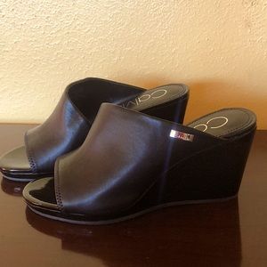 Clog with a solid heel. Never used .